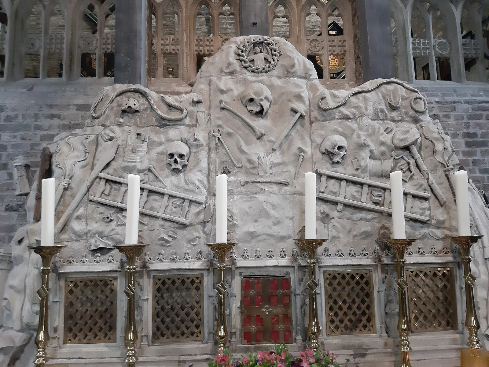 The carved stone altar with skulls and symbols of the Passion inside the Jeruzalem Church