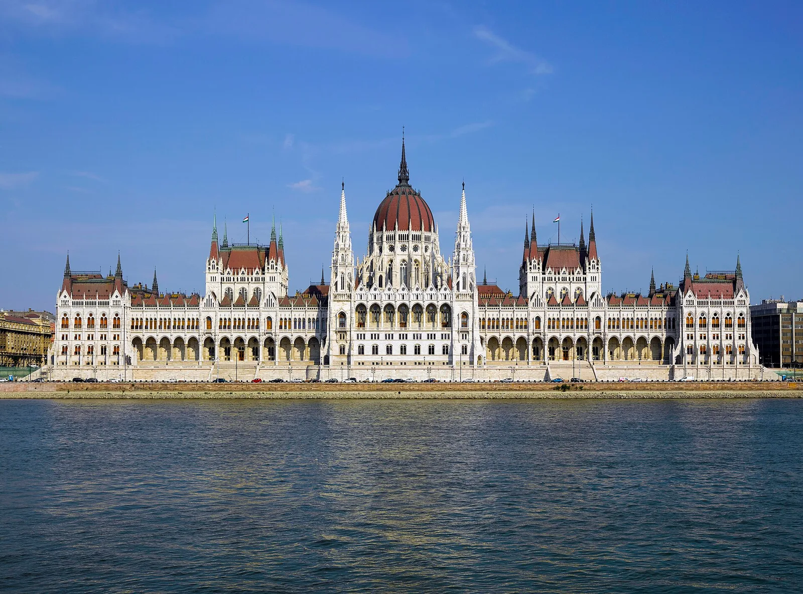 The neo-Gothic Hungarian Parliament Building and its red dome on the Danube bank