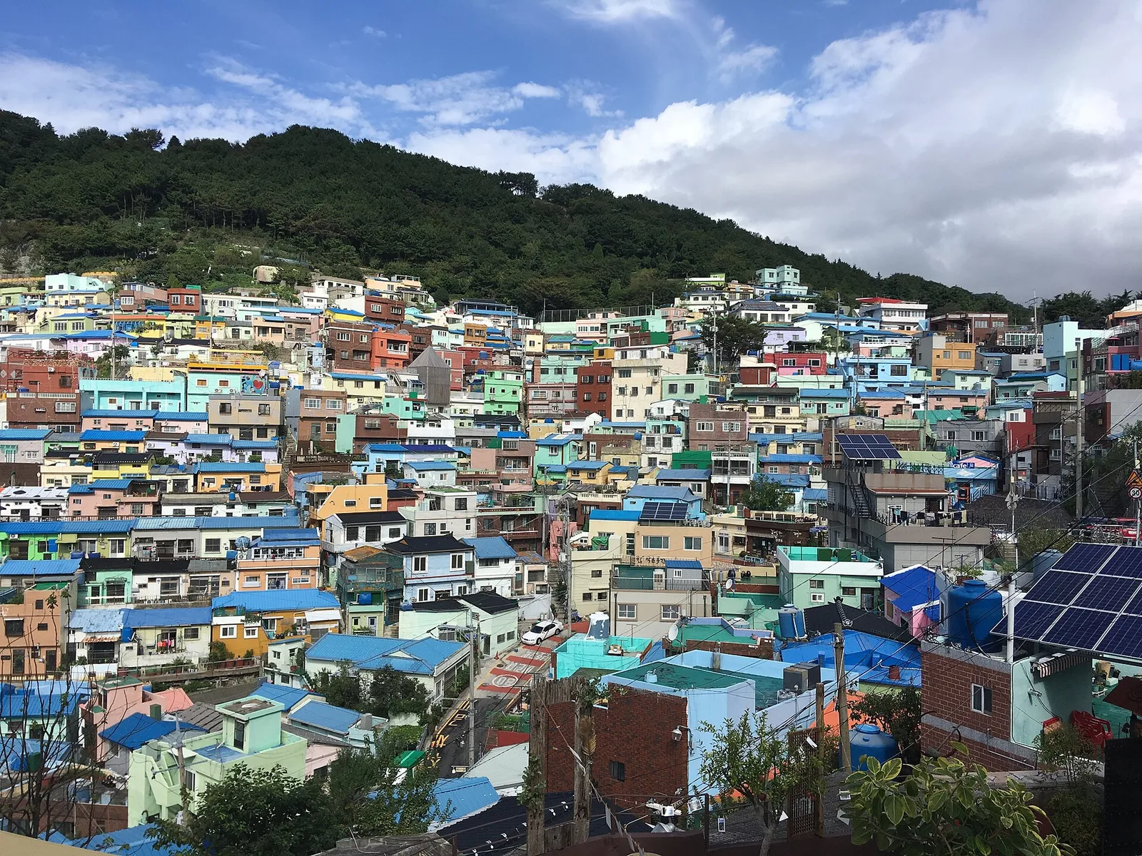 The terraced, pastel-colored houses of Gamcheon Culture Village on the hillside