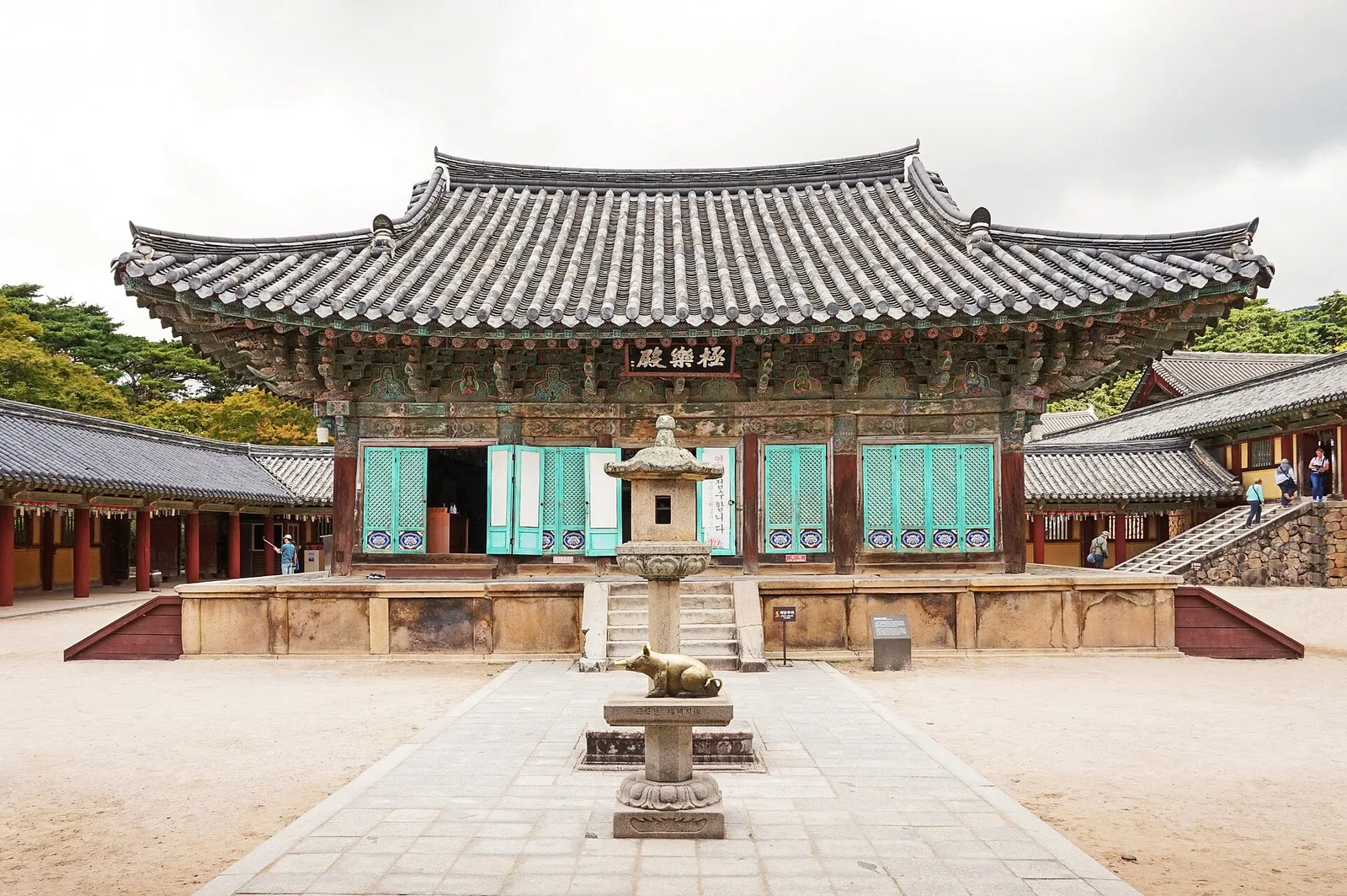 The main hall of Bulguksa seen across its stone courtyard, with a stone lantern in front