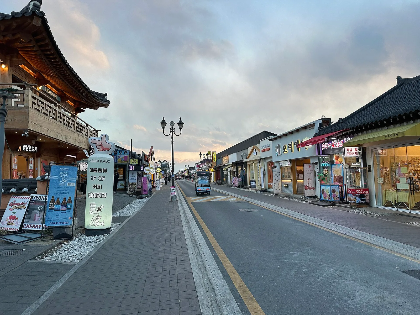 Hwangnidan-gil, a street of hanok-style shopfronts, at dusk