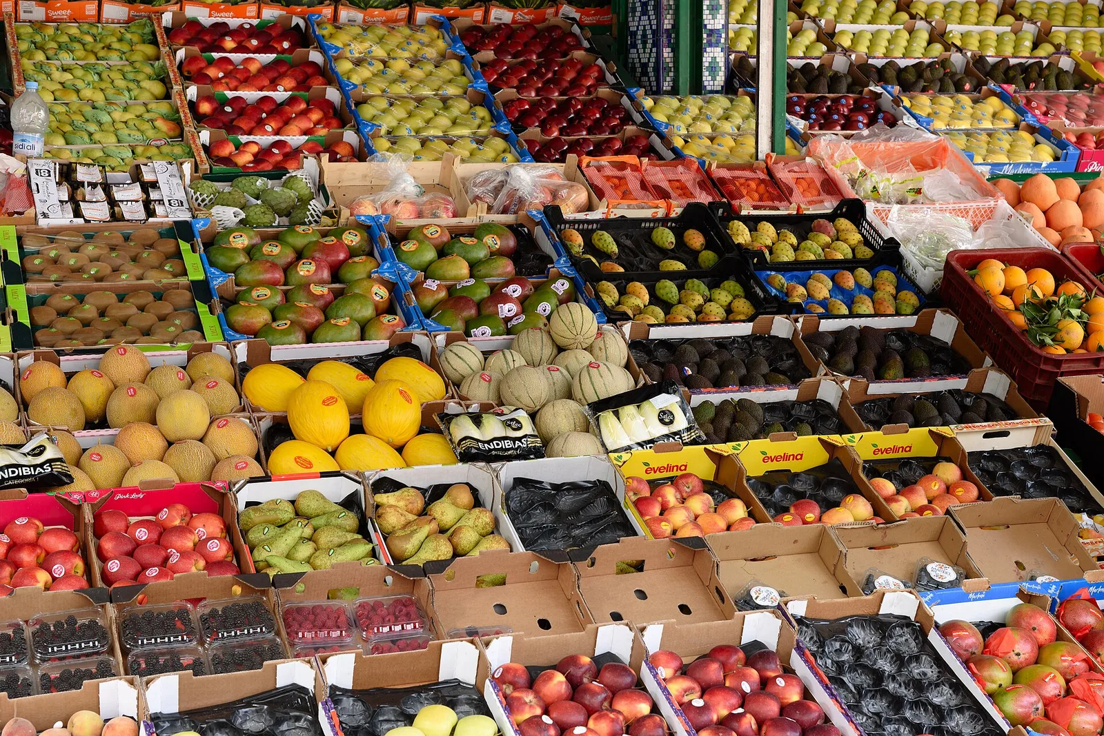 Crates of fresh fruit stacked at a stall in the Central Market
