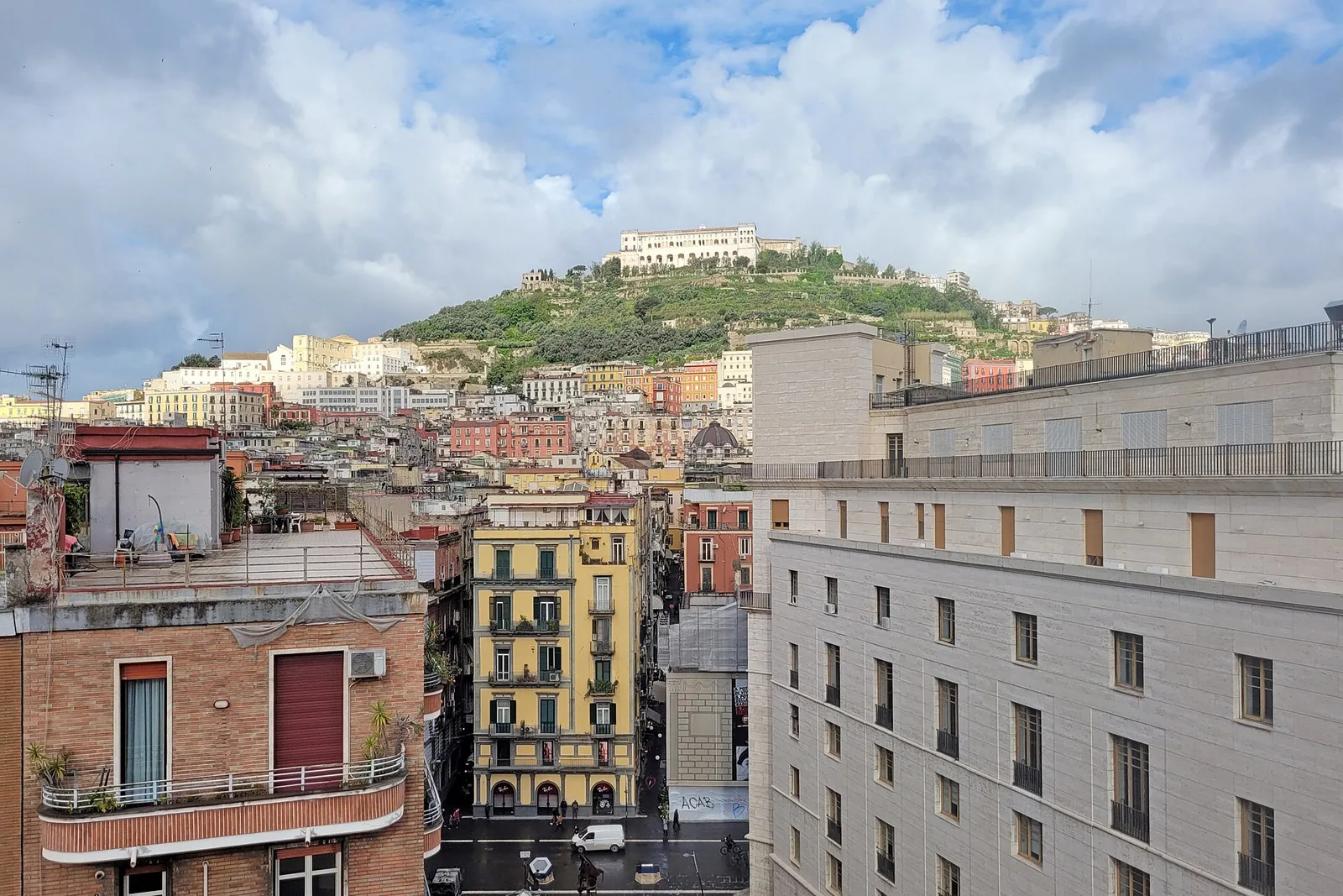 The Vomero hill rising above the rooftops of Naples, with the Certosa di San Martino near the top