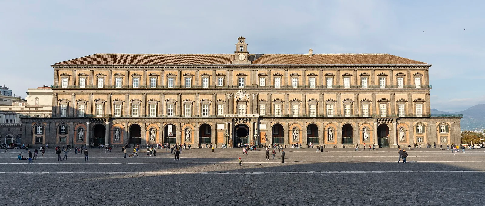 The long, arcaded facade of the Royal Palace of Naples on Piazza del Plebiscito