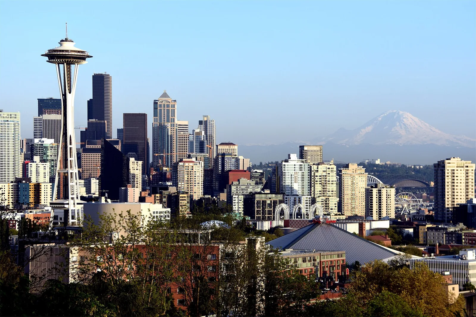 The Seattle skyline with the Space Needle and snow-capped Mount Rainier in the distance