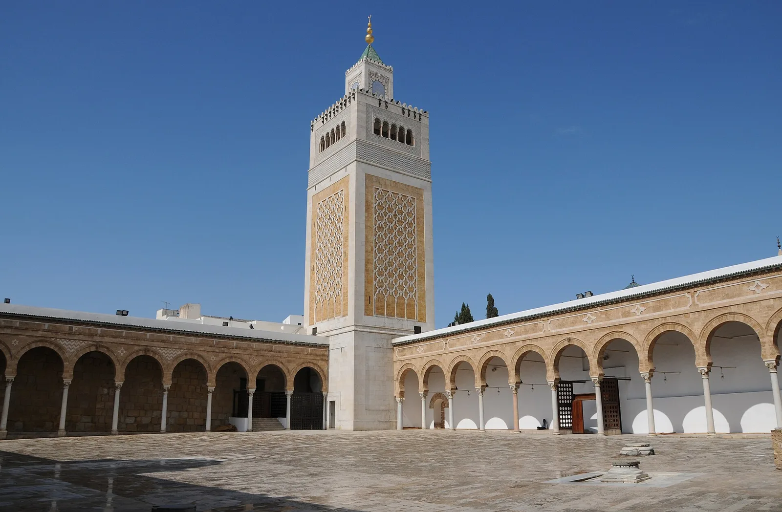 The courtyard of the Zitouna Mosque, with its arcades and tiled square minaret